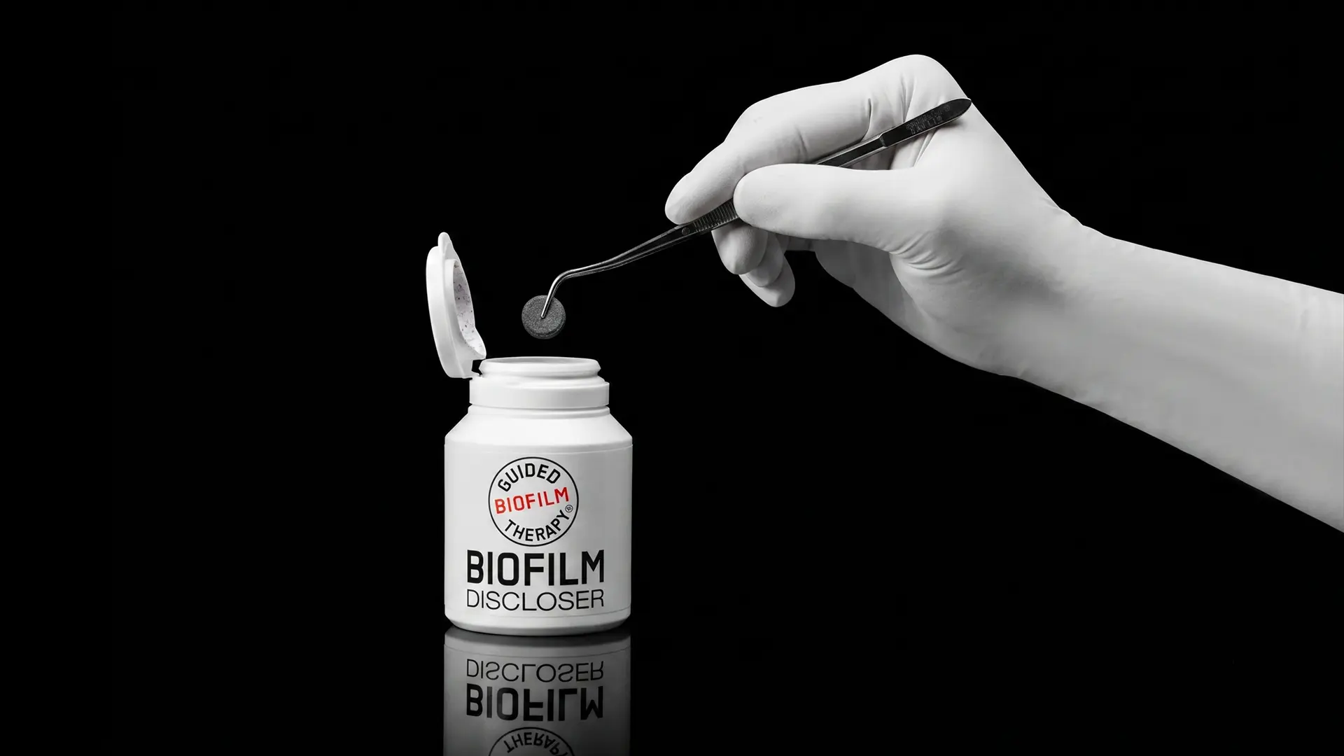 Biofilmo dažiklio tabletė ir buteliukas